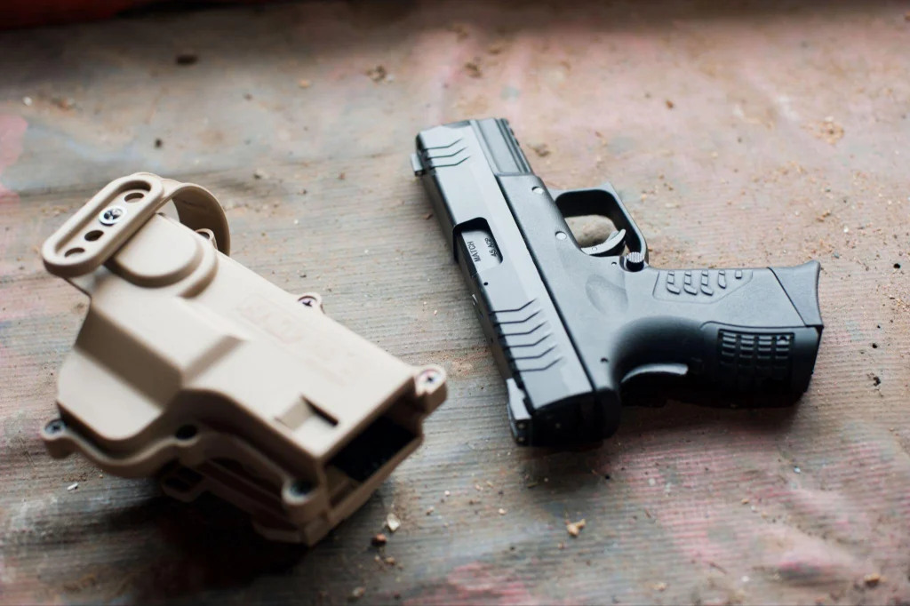 Handgun and holster representing firearm rights restoration in NC