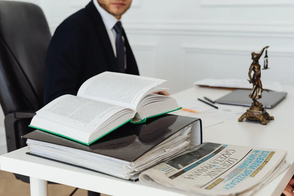 Attorney reviewing law books on desk for firearm rights restoration NC case